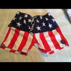 Swim trunks made from red, white and blue fabric.